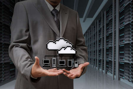 Businessman show cloud network icon on server room backgroundの写真素材