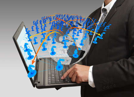 business man pressing computer laptop and social networkの写真素材