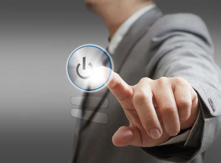 hand pushing a button on a touch screen interfaceの写真素材