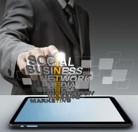 business man hand shows 3d word internet conceptの写真素材