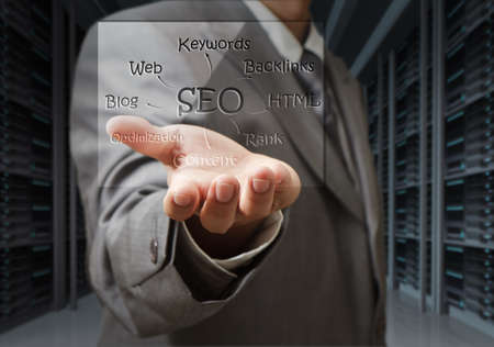 business man show seo diagram shield in server roomの写真素材