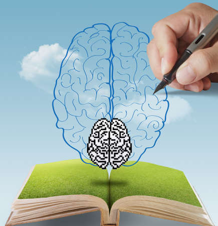 open book of hand drawn pixel brain as conceptの写真素材