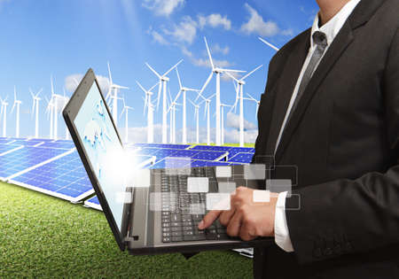 business man checks system with laptop computerの写真素材