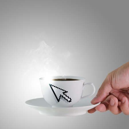 hand holds a cup of coffee with arrow cursor signの写真素材