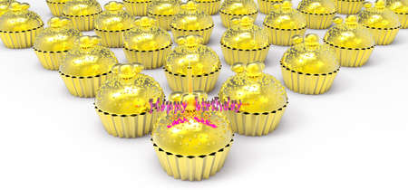 gold birthday cupcake with candleの写真素材