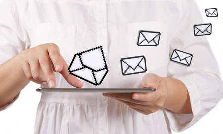 business woman using tablet computer and email iconsの写真素材
