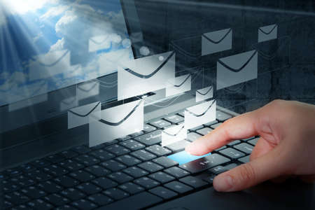 hand press button and e-mailの写真素材