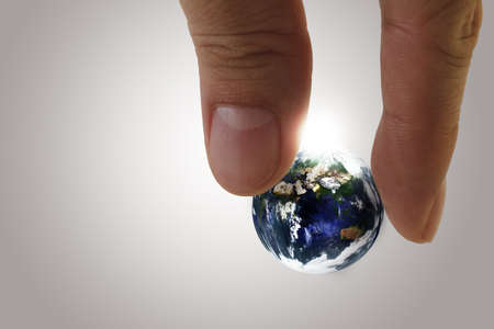 globe in fingers"Elements of this image furnished by NASA"の写真素材