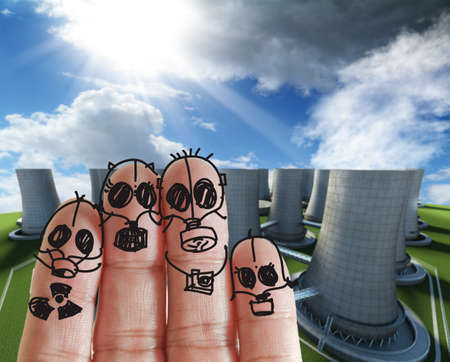 fingers family with nuclear power plantの写真素材