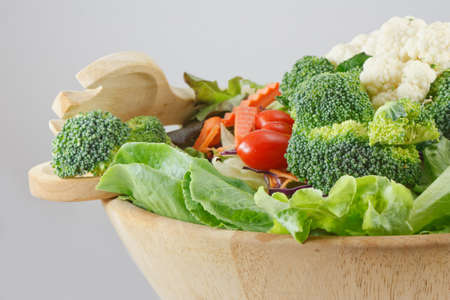 Wooden bowl of mixed saladの写真素材
