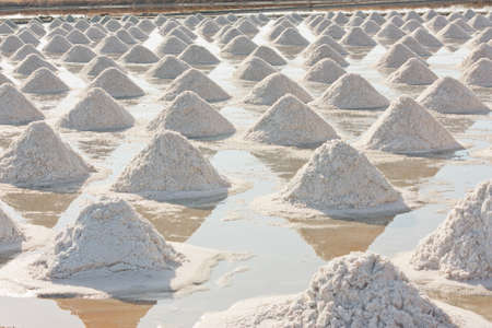 Salt texture with farmer, salt pile in Thailand, salt panの写真素材