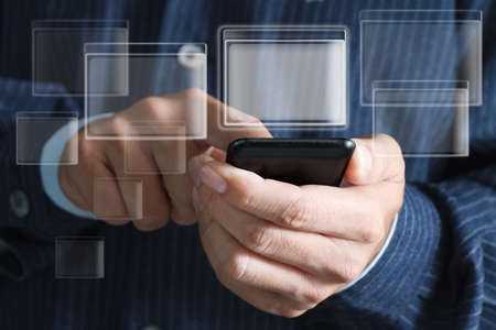 Touch screen mobile phone, in handの写真素材