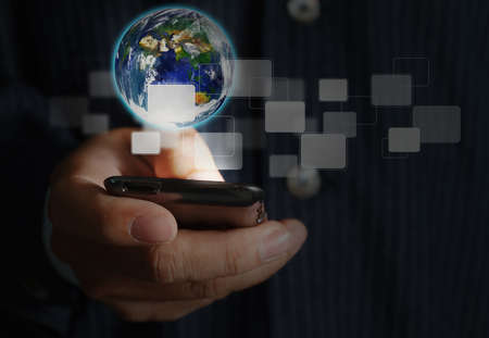 Touch screen mobile phone, in handの写真素材