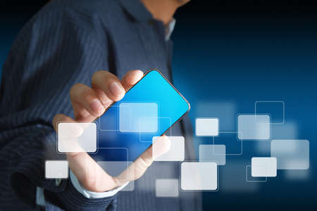 Touch screen mobile phone, in handの写真素材