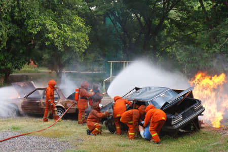 Firefighters fighting fire during trainingの写真素材