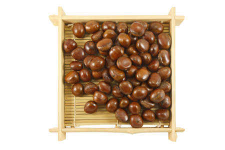 Horizontal image of a pile of chestnuts in a marketの写真素材