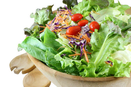 Wooden bowl of mixed salad on whiteの写真素材