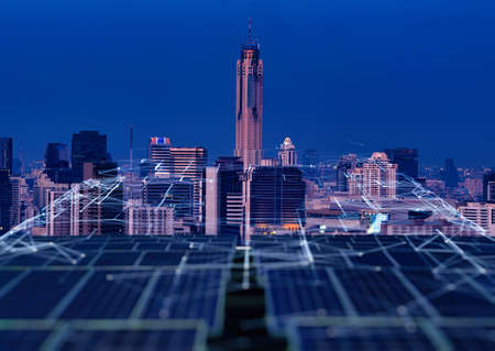 Smart green city and renewable concept.Ai solar panels linkage to  the city need power. Green energy for the city.の写真素材