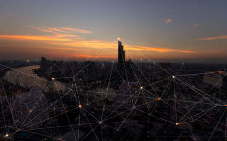 Wireless network and Connection technology concept with Abstract buildings and city backgroundの写真素材