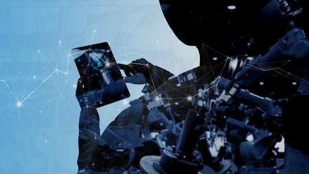 Double explosure of Factory Female Industrial manager Engineer looking at automation robot arms...