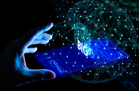 Big data world and globe smart pohone ui with hand selecting and pressing Big Data symbol and modern interface.の写真素材