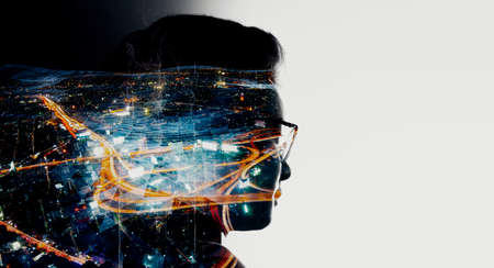 Double exposure of Asian woman silhouette and modern renewable city skyline background.Energy...
