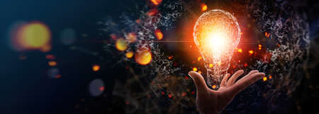 Creativity on connectivity.Innovative idea.Inspiration and network. Hand showing digital light bulbs as symbol of innovation on global network connection.の写真素材