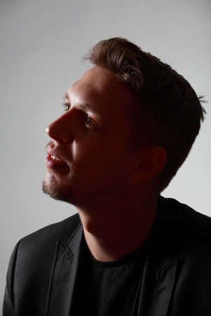 Studio low key portrait of young manの写真素材