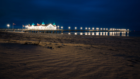 The historic pier of Ahlbeck on the sunny island of Usedom, recorded in the evening with a long exposure.の写真素材