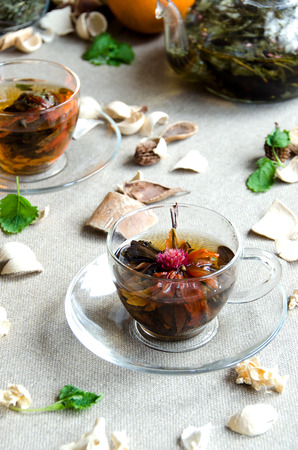 cup oolong tea glass with fruit and glass kettleの写真素材