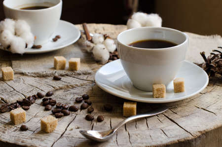 pair cups coffee old wooden stump napkins, lump, sugar, cones, cottonの写真素材