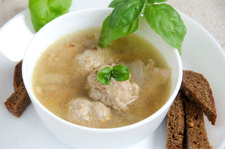 buckwheat soup meatballs white plate on a gray backgroundの写真素材