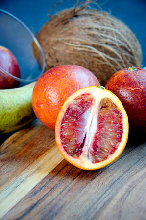 group of blood oranges on a dark textured backgroundの写真素材