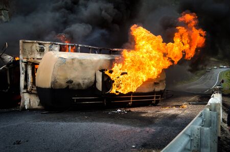 Burning gas flame tank truck road accident on the track selective focusの写真素材