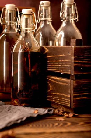 Group bottles Tincture alcohol  propolis  herbs  glass on a rustic wooden background with bottles and wooden box Space for textの写真素材