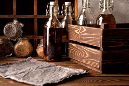 several bottles Tincture alcohol  propolis  herbs  glass on a rustic wooden background with bottles and wooden box Space for textの写真素材