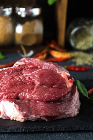 beef  black plate lime pepper arugula on dark background closeupの写真素材