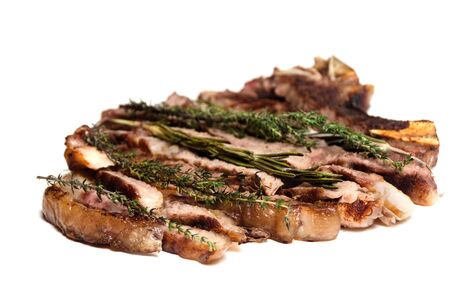 well done barbecue steak rosemary marjoram on a white background close up