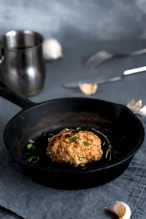 Cooked fried cutlet pan on a gray backgroundの写真素材