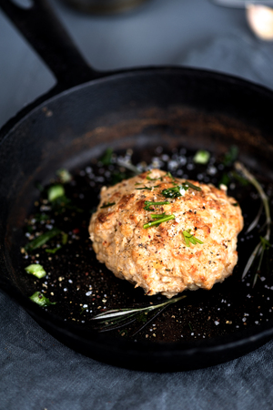 Cooked fried cutlet pan greenery on a gray backgroundの写真素材