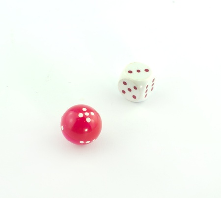 Square and spherical dice isolated on white background