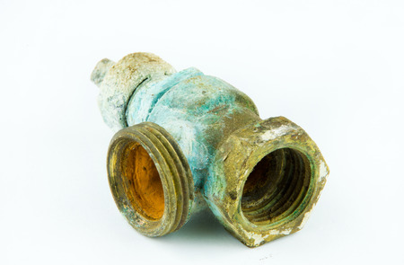 Old rusty valve for radiator isolated on white background 