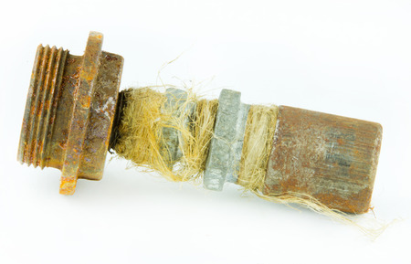 Old rusty valve for radiator isolated on white background 