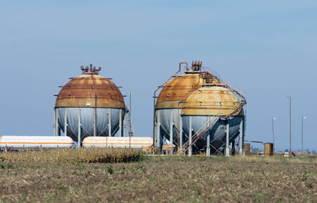 Gas storage tanks on cloudy dayの写真素材