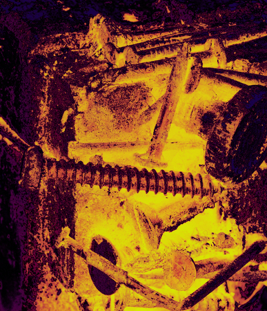 Old magnet with rusty screws attached isolated on dark backgroundの写真素材