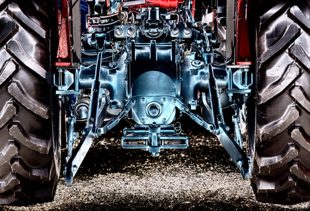 Rear view of new modern red tractor, artistic effects on imageの写真素材