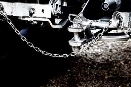 Close up of new tractor hitch with tow bar and chains, artistic effects on imageの写真素材