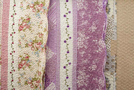 Close up of flowered and colored tablecloths assorted for sale