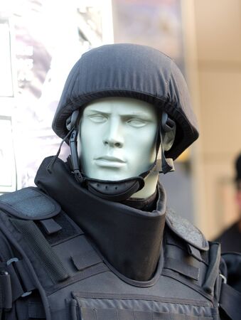 Police helmet and safety vest on the dollの写真素材