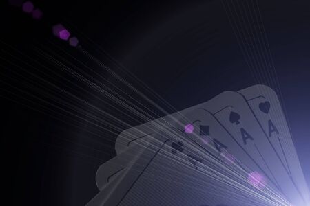 Close up of poker hand of four aces against black background with special lighting effects